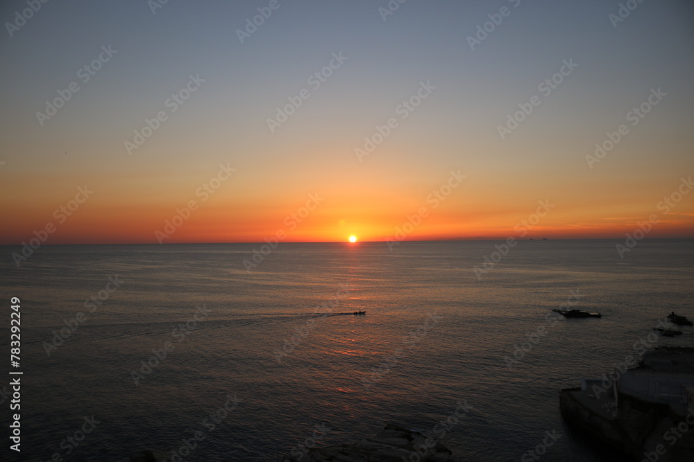 sunset over the sea with cloudy sky	, landscapes