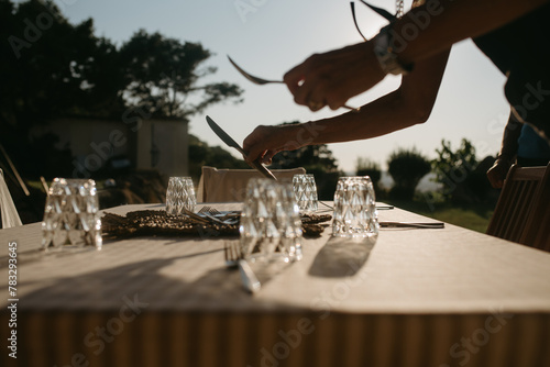 Woman's hand setting the table  photo