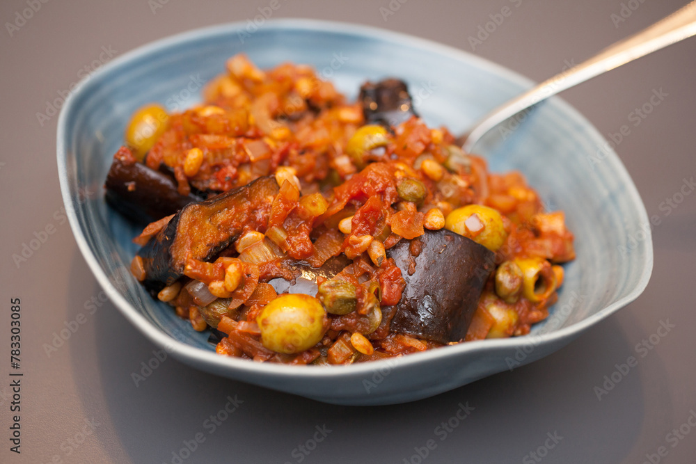 An Italian dish called Caponata with aubergines and pine nuts An Italian dish called Caponata with aubergines and pine nuts