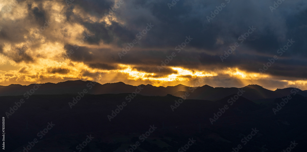 Horizon at sunrise, sunset over mountains, clouds, storm