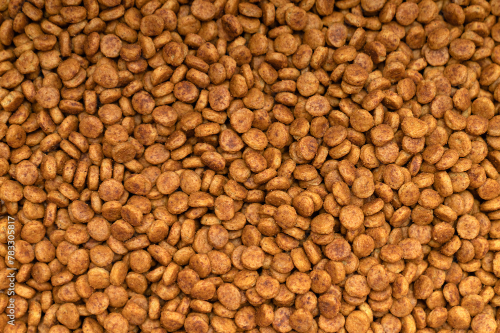 Food for animals background. Dry cat and dog food texture, pattern. Pet meal background close up. Dry food for pet dogs and cats. Dried pet food top view. Granules of good nutrition for dogs and cats. Food for animals background. Dry cat and dog food texture, pattern. Pet meal background close up. Dry food for pet dogs and cats. Dried pet food top view. Granules of good nutrition for dogs and cats.