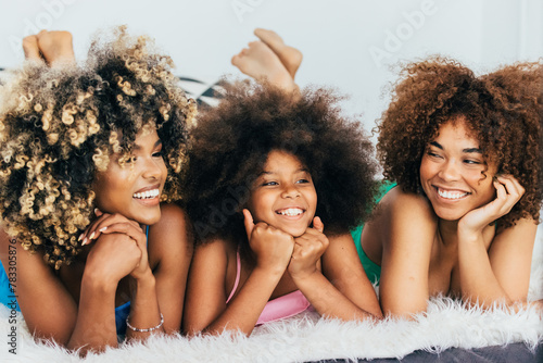 Joyful family moments with three smiling females photo