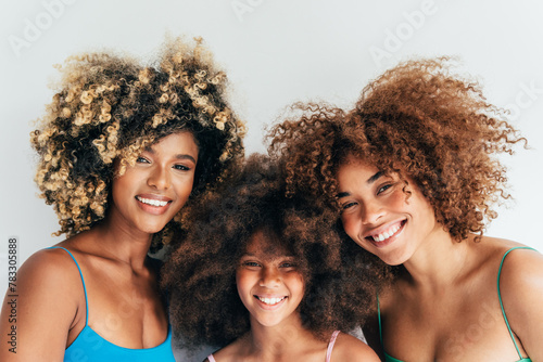 Beautiful smiling family showcasing natural curly hair photo