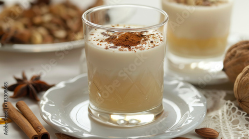 Close-up of a creamy egyptian sahlab served in a glass, garnished with cinnamon