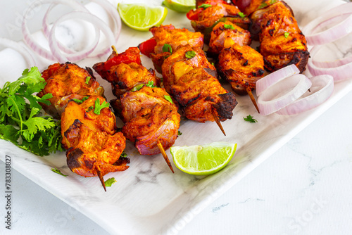 Indian Chicken Tikka Kebab with Green Chutney and Cilantro  and Lemon
