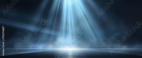 Blue spotlight with rays on dark background