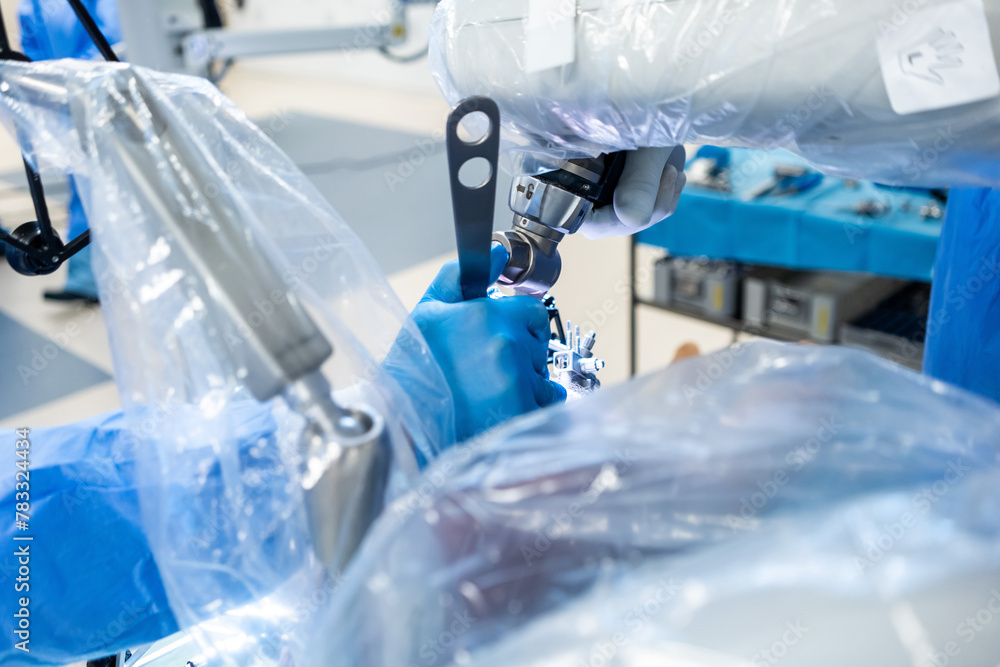 Team of doctor perform total hip arthroplasty replacement surgery in osteoarthritis patient