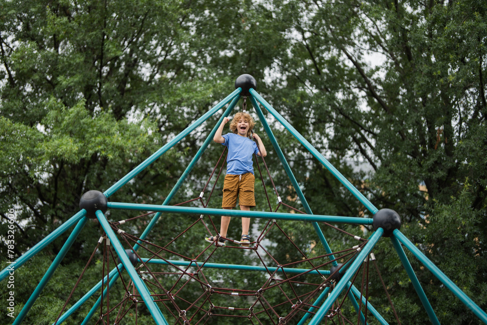 Kid doing climbing in the background. Kid winner leader concept. Brave successful child in the summer background. Kid motivation and success. Kids goal concept. Kid doing climbing in the background. Kid winner leader concept. Brave successful child in the summer background. Kid motivation and success. Kids goal concept.
