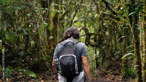 man walking in the middle of the Colombian jungle