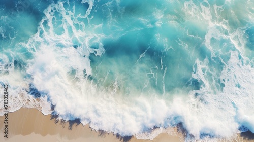 This image captures the breathtaking view of foamy ocean waves meeting the sandy beach from an aerial perspective, inducing a sense of calm and majesty photo