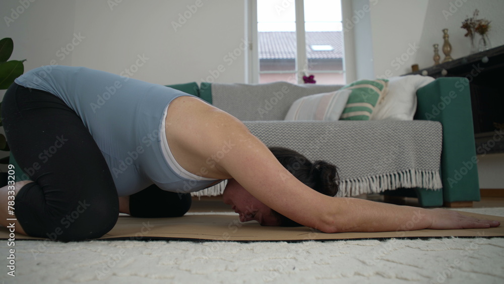 Third Trimester Pregnancy Back Care - Pregnant Woman on Living Room Floor Performing Safe Exercises at Home, Specifically Designed to Reduce Back Pain Third Trimester Pregnancy Back Care - Pregnant Woman on Living Room Floor Performing Safe Exercises at Home, Specifically Designed to Reduce Back Pain