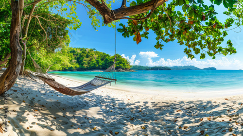 Tropical beach background. Beach hammock hangs on a palm tree over golden sand, calm sea or ocean and sunny sky. Paradisaic delight. Vacation or vacation concept.