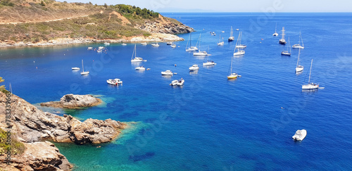 Panorama of the azure sea and boats near Barbarossa beach, Elba island. photo