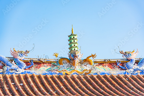 The Dragon and Pagoda on the roof of the main hall of Kaiyuan Temple in Quanzhou, Fujian, China photo