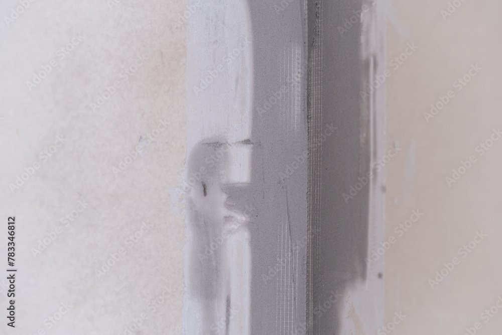 Applying decorative putty. White abstract texture of surface covered with putty Applying decorative putty. White abstract texture of surface covered with putty