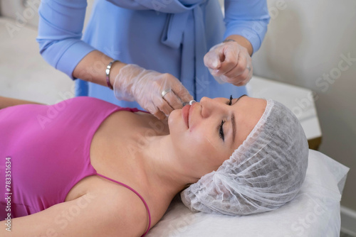 Expert performs a delicate injection, part of a skin-enhancing protocol. This is the intersection of health and beauty.