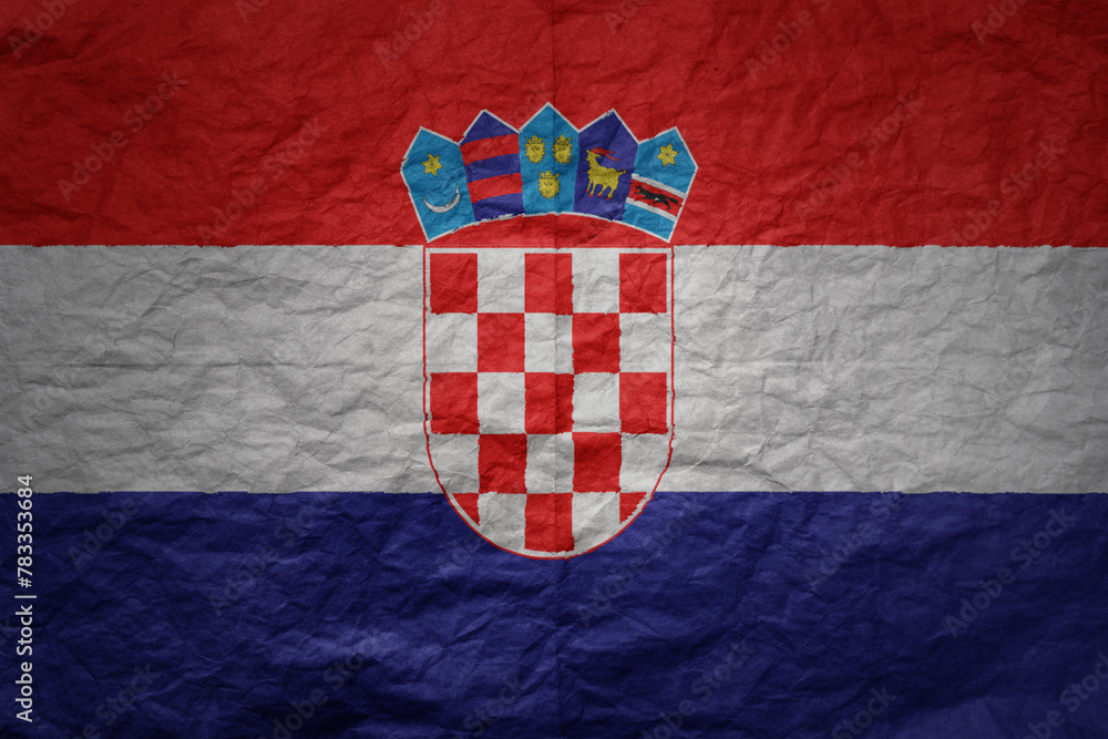 big national flag of croatia on a grunge old paper texture background