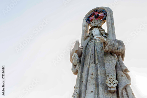 Statue in the shape of a virgin of the seas, with a ship in her hand