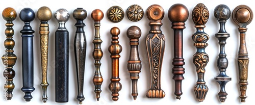Collection of decorative furniture handles in mixed finishes. Ornate metal knobs and pulls on white backdrop. Concept of cabinetry hardware, interior design variety, home fittings. Top view