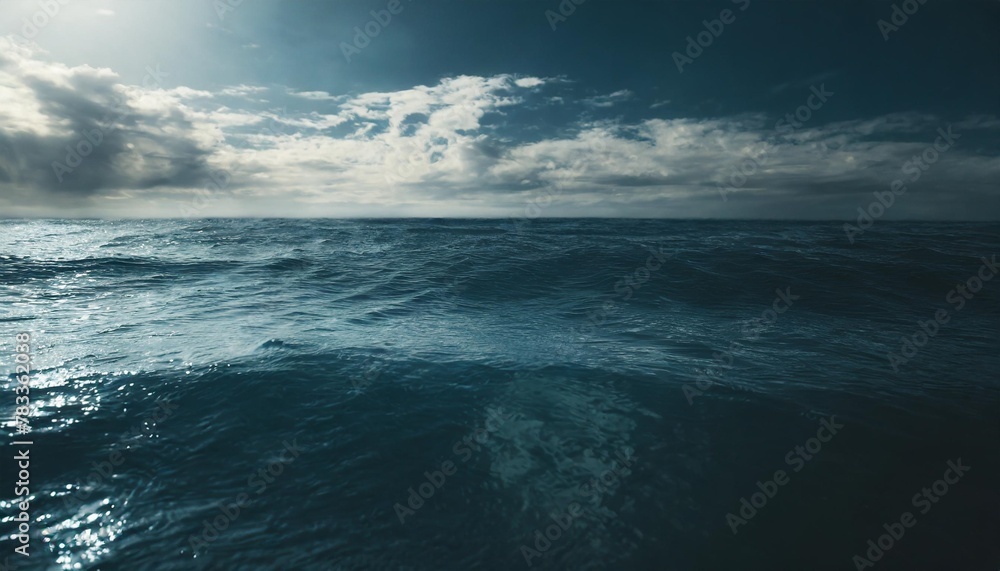 closeup surface of calm ocean blue sea water with day light and clouds abstract background texture