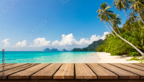 empty wooden table on blurred tropical sea and sky background © Nathaniel