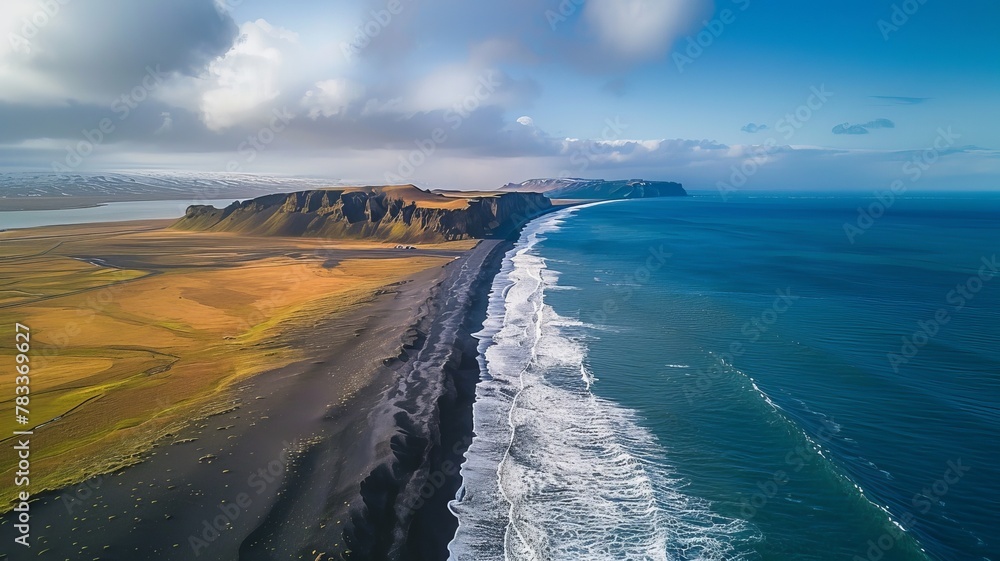 Fototapeta premium The black sand beach in Iceland. Aerial view and top view. Beautiful natural backdrop