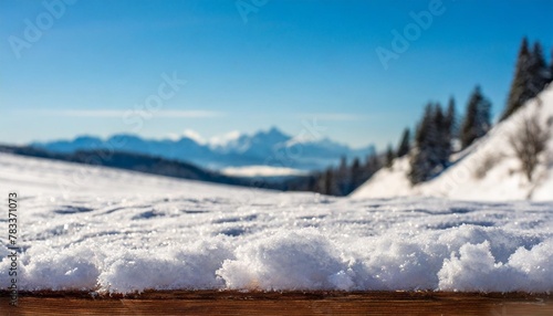 board cover of snow with frost and blurred landscape of moutains christmas mockup background and empty space for your decoration sunny cold december day natural light and free space for your product