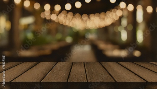 empty wooden table top with lights bokeh on blur restaurant background