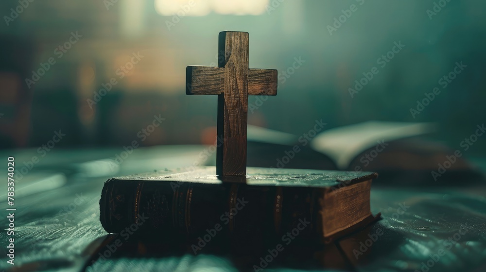 Closeup of simple wooden Christian cross on Bible , vintage tone , god