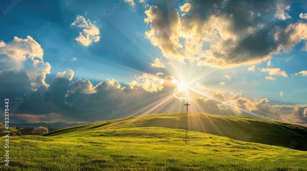 This dramatic Easter Morning Sunrise panorama with blue sky, bright clouds, sunbeams, and large cross on a grass covered hill makes a great banner cover for print or web. - obrazy, fototapety, plakaty 