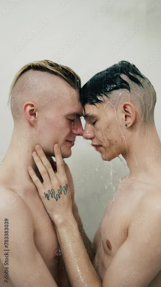 Two sexy guys are washing in the shower and kissing Two sexy guys are washing in the shower and kissing