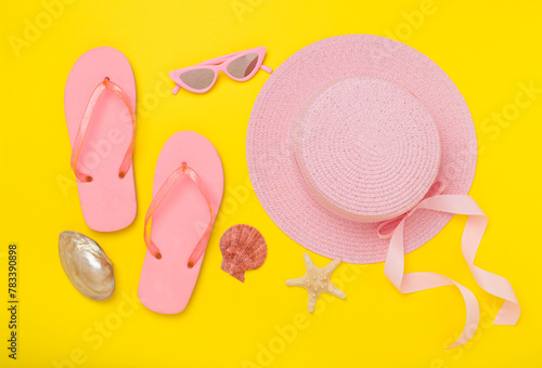 Flat lay with pink summer outfit on color background. Vacation concept