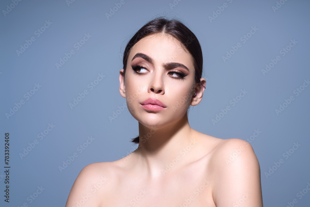 Woman standing over gray background thinking about question. Pensive expression. Thoughtful face. Doubt concept. Thinking question, thoughtful about confusing idea. Woman standing over gray background thinking about question. Pensive expression. Thoughtful face. Doubt concept. Thinking question, thoughtful about confusing idea.