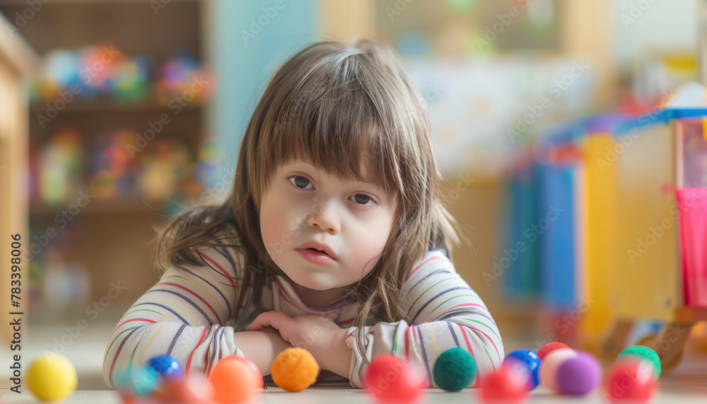 Sensory Processing Support: Child with Down Syndrome Engages in Sensory Integration Therapy for Sensory Sensitivities. Learning Disability Sensory Processing Support: Child with Down Syndrome Engages in Sensory Integration Therapy for Sensory Sensitivities. Learning Disability