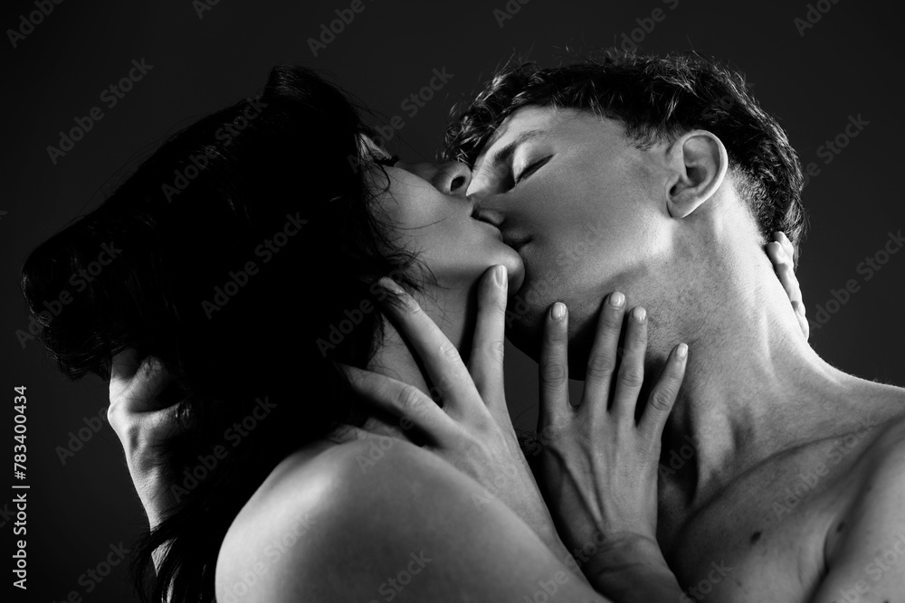 Sexy kiss. Couple in love kissing. Passionate kiss. Romantic moment. Tender lovers. Couple embrace and kissing. True love. Loving embrace. Dreamy kiss. Romantic gesture. Love in a kiss.