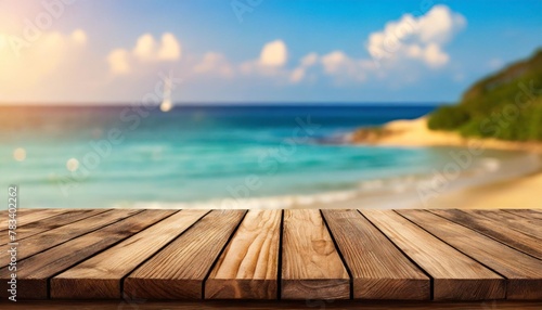 empty wooden table on blurred light and beach background