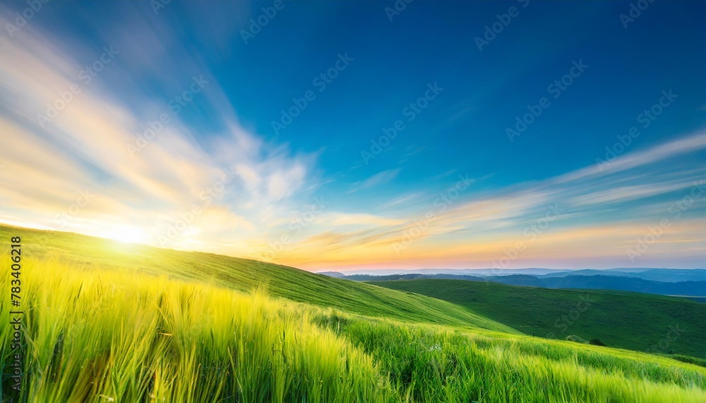 abstract bright gradient motion spring or summer landscape texture with natural yellow green lights and blue bright cloudy and sunny sky autumn or summer background with copy space