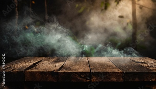 old wood table top with smoke in the dark background