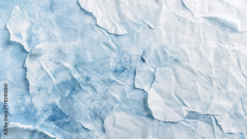 Crumpled paper texture with light blue tones, resembling ice or water.