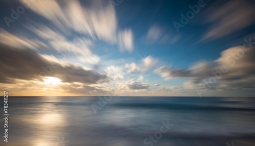 abstract motion blur background of the sea with blue sky and clouds © Kira