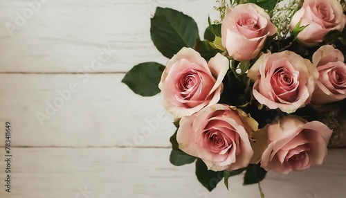 bouquet pink roses on a white wooden table valentine background top view © Kira