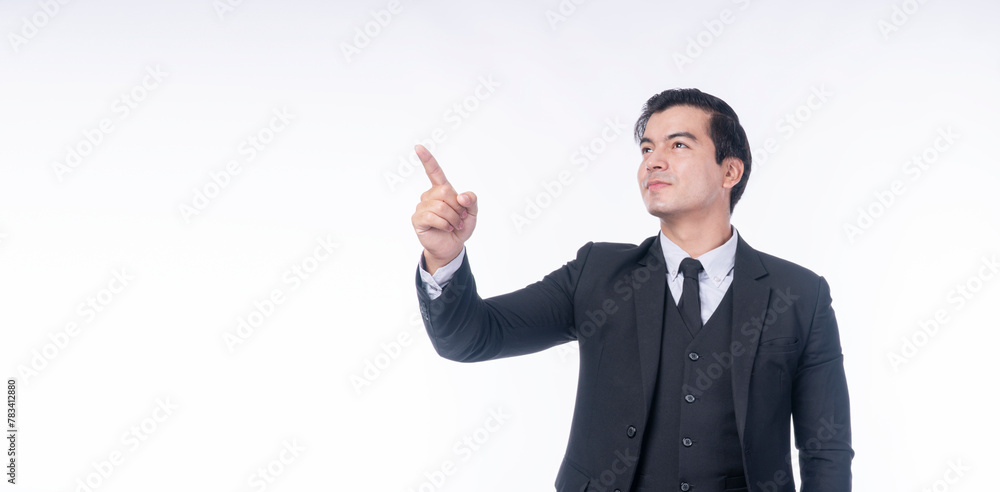 Confident positive handsome young businessman wear suit pointing up own finger presenting product or copy space while standing over isolated white background. Advertisement gesture pleased concept. Confident positive handsome young businessman wear suit pointing up own finger presenting product or copy space while standing over isolated white background. Advertisement gesture pleased concept.