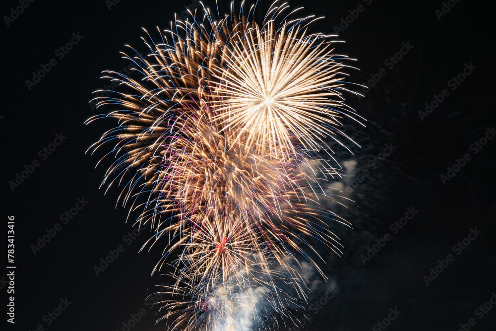 Celebration shiny sparkling golden fireworks festival with smoke on sky dark night background. Pyrotechnics shine tail twinkling glow bright greeting carnival countdown celebrate season event. Texture Celebration shiny sparkling golden fireworks festival with smoke on sky dark night background. Pyrotechnics shine tail twinkling glow bright greeting carnival countdown celebrate season event. Texture