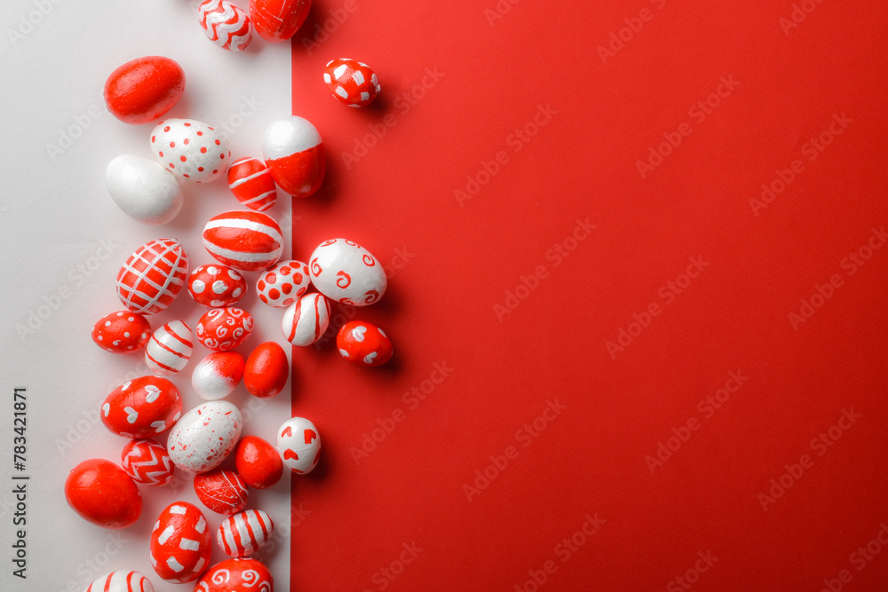 Easter backgrounds, a strip of Easter red and white eggs on a white-red background. Copy space. Flat lay, top view