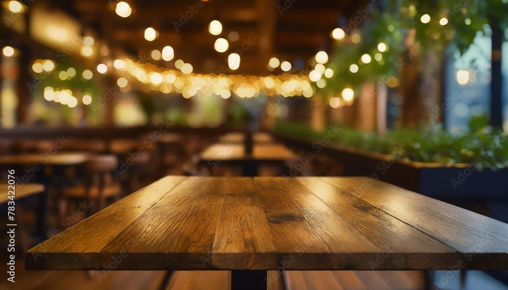 wood table top on blur restaurant cafe interior background