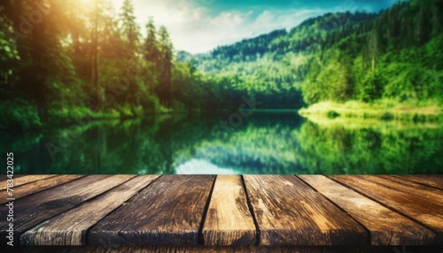 the empty wooden table top with blur background of summer lakes green forest high quality photo © Tomas