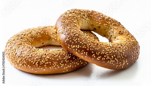 fresh round wheat bagel with sesame seeds isolated on white background with clipping path cut out bagel element for advertising crispy bread healthy organic food mockup