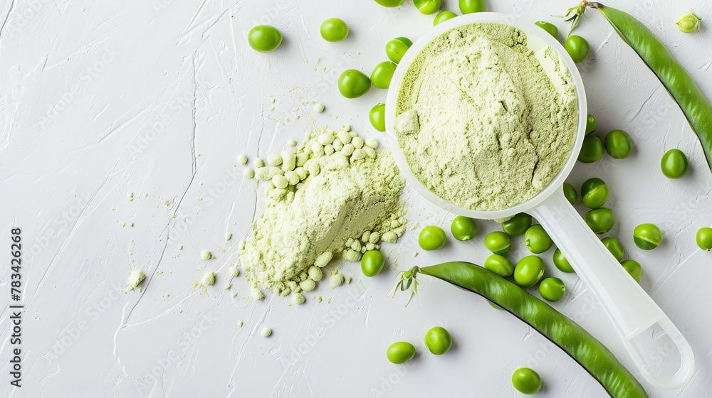 A plastic scoop filled with plant-based pea protein powder, accompanied by fresh green pea seeds, all against a white background. An isolated copy space for additional text or design elements - obrazy, fototapety, plakaty 
