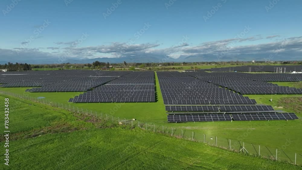 Ecology solar power station panels in the fields green energy at sunset landscape electrical innovation nature environment. Aerial view Ecology solar power station panels in the fields green energy at sunset landscape electrical innovation nature environment. Aerial view