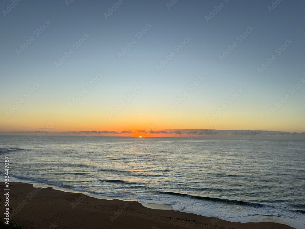 View of a sunrise over the ocean at a beach in Australia in Summer 